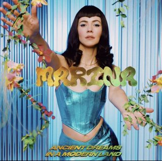News Added Apr 14, 2021 After teasing the arrival of new single "Purge The Poison" (which comes after "Mans' World"), Marina has unveiled the track alongside announcing her highly-anticipated fifth album "Ancient Dreams In A Modern Land", to be released on June 11th. The announcement comes after two years since the release of "Love + […]